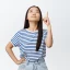 unsure-young-asian-woman-pointing-looking-up-with-troubled-white